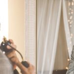 Man staring at himself in the mirror fixated on himself