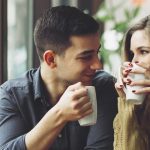 Cute couple having a coffee date gazing into each other's eyes