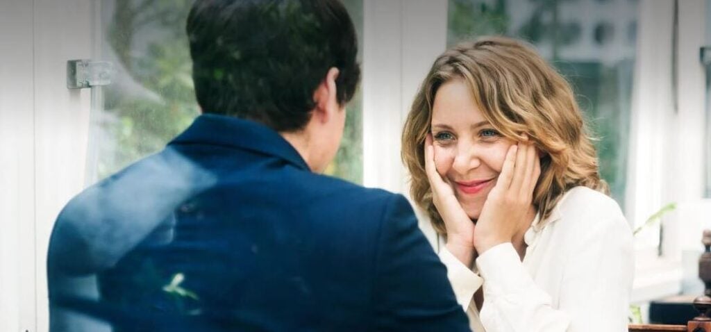 Two christian singles on a date look at each other
