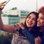 Two woman making a photo together