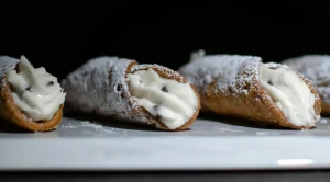 Cannoli with powdered sugar and cream (Generated with AI)