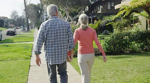 A couple walking in the neighborhood. (Generated with AI)